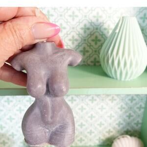 A nude Female torso bust candle in mocha